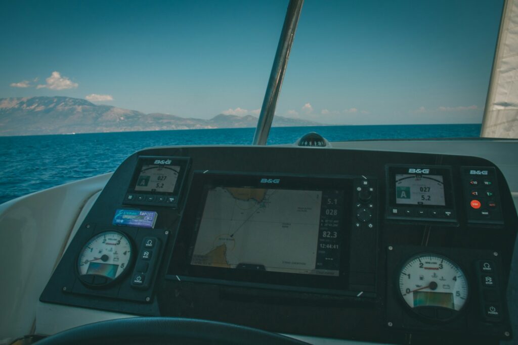 the dashboard of a boat on the water